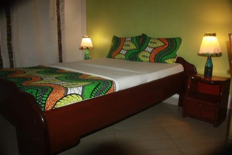 Modern hotel room with comfortable bed and work desk